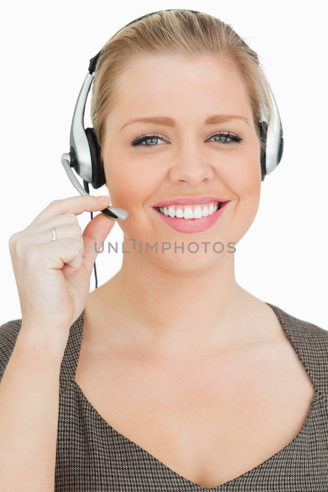 Smiling woman working in a call center against white background