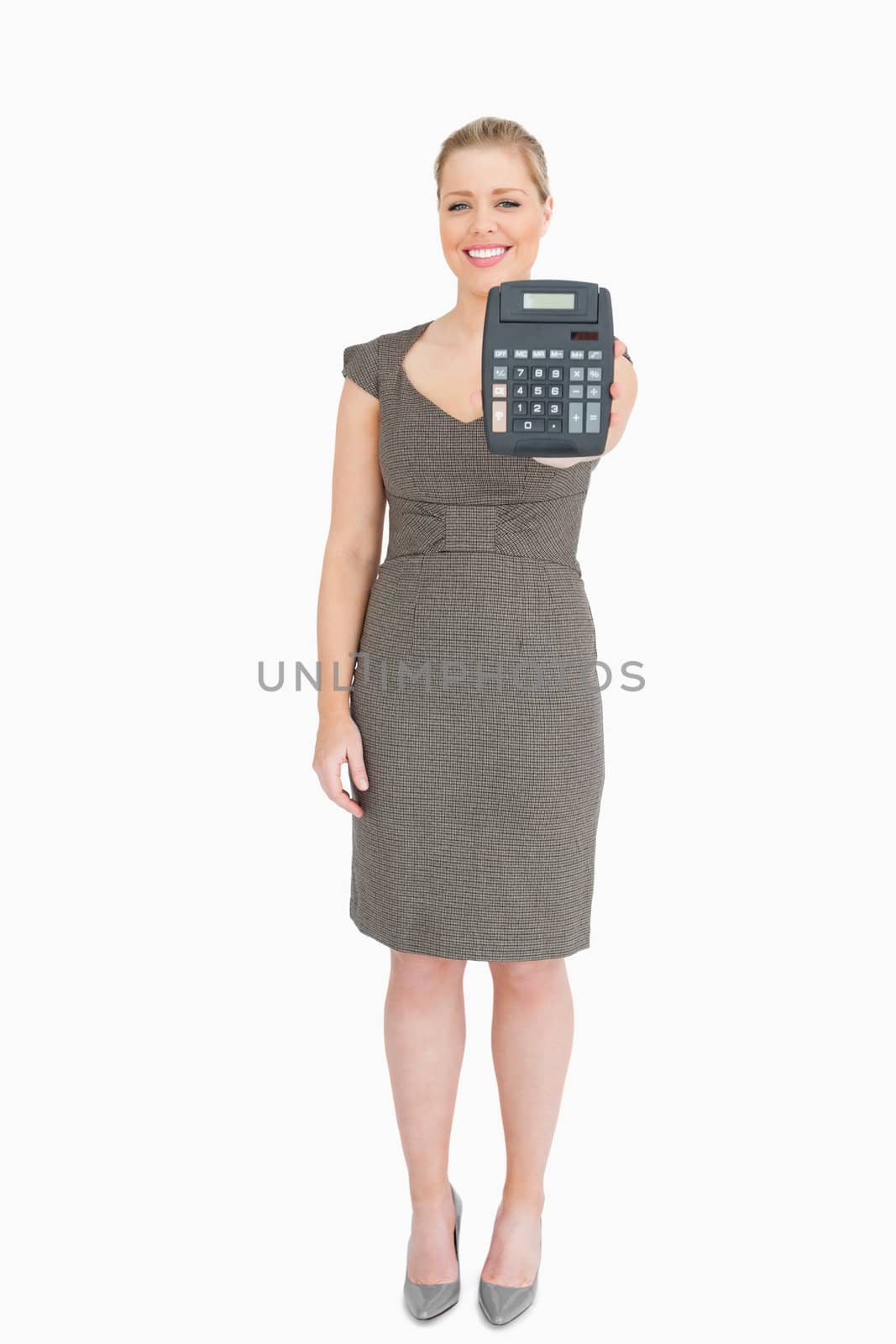 Woman showing a calculator against white background