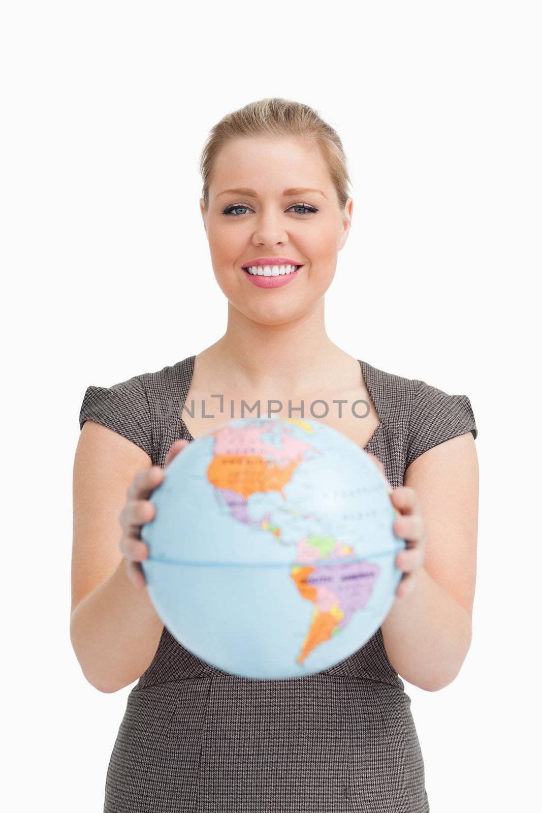 Woman holding a globe against white background