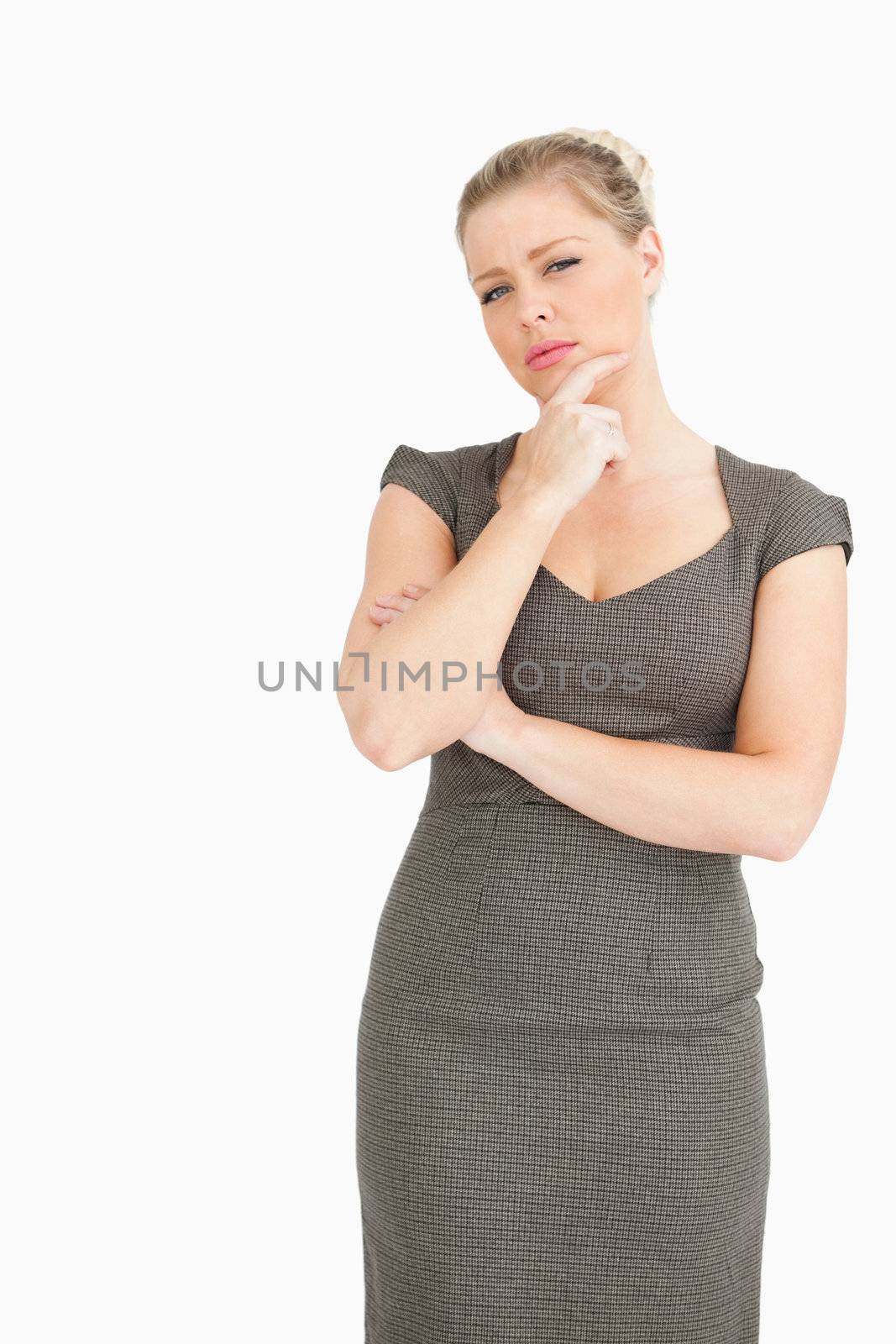 Woman thinking at something against white background