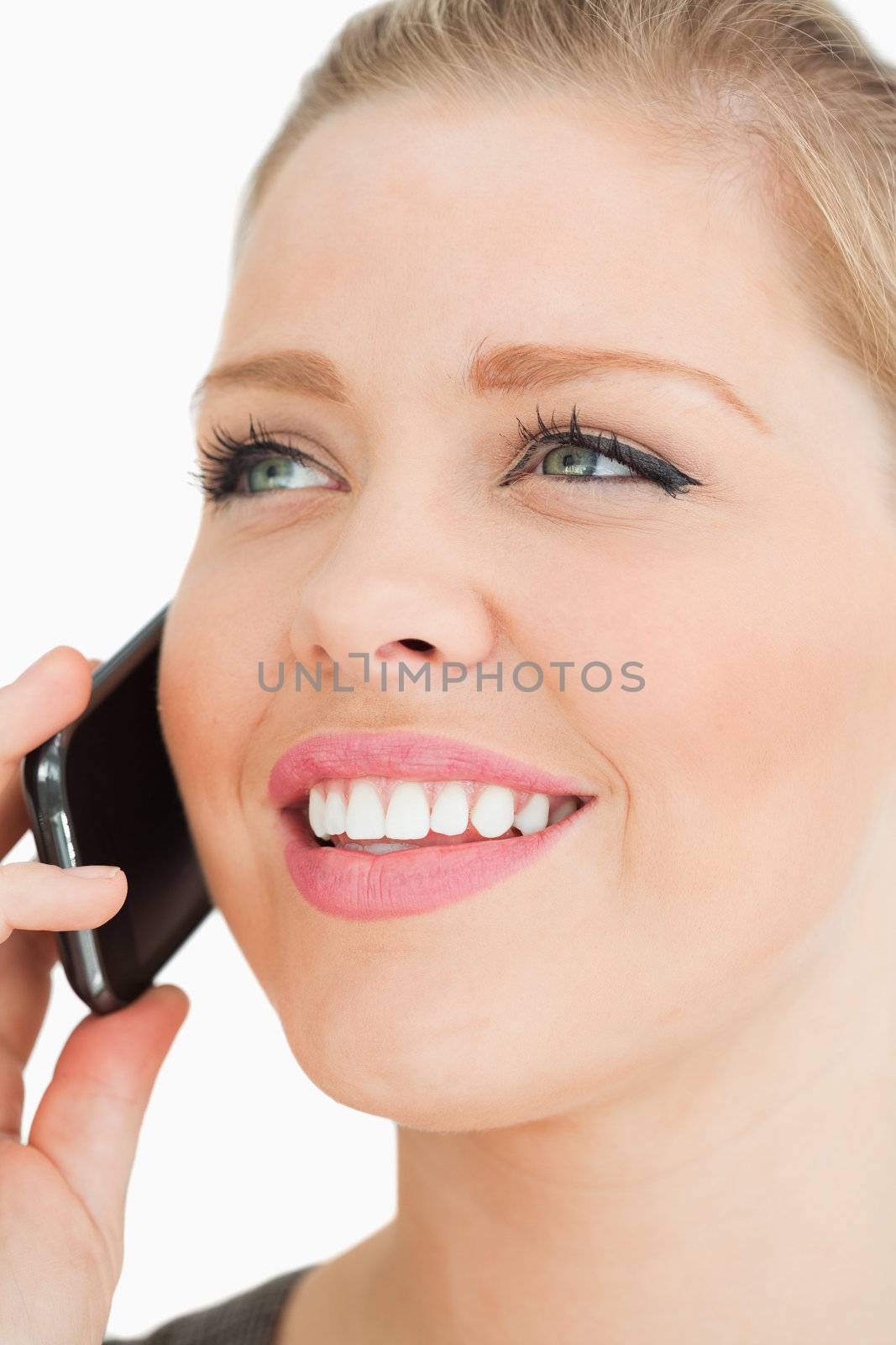 Close up of a pretty woman calling against white background