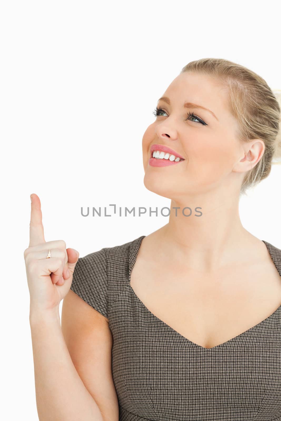 Woman smiling showing something against white background