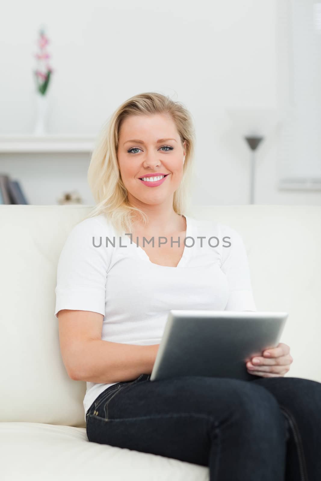 Casual woman using a notebook in a living rrom