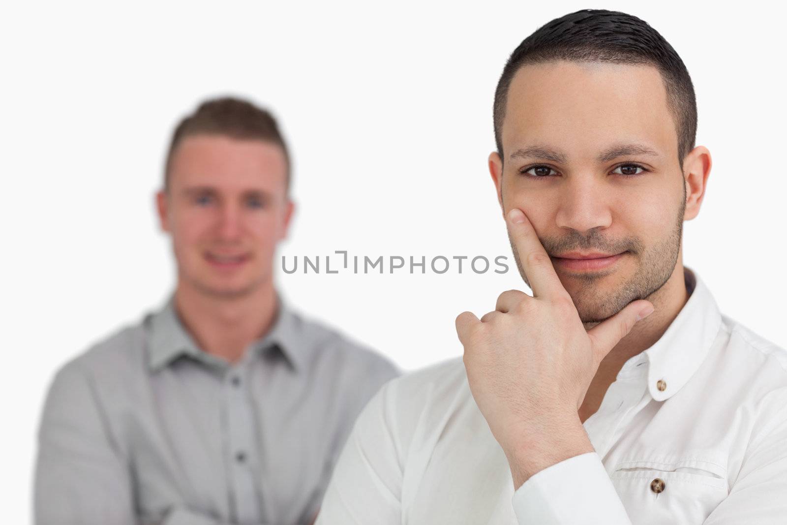 Smiling men together against a white background
