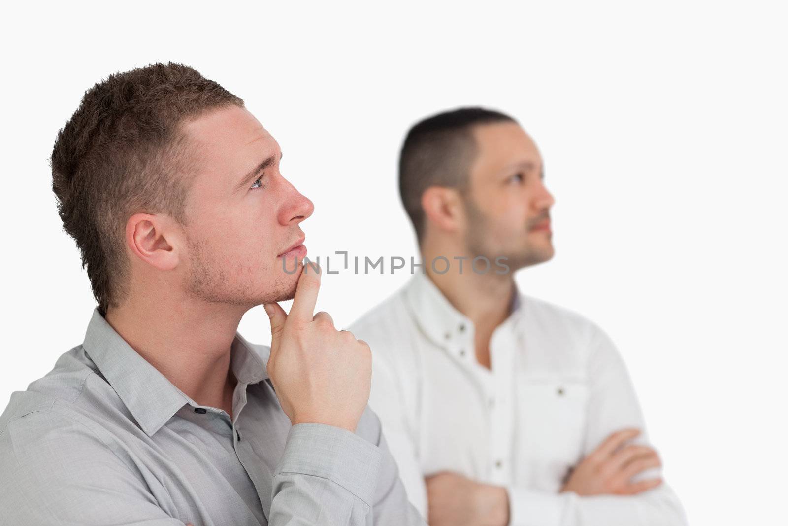 Thinking men against a white background
