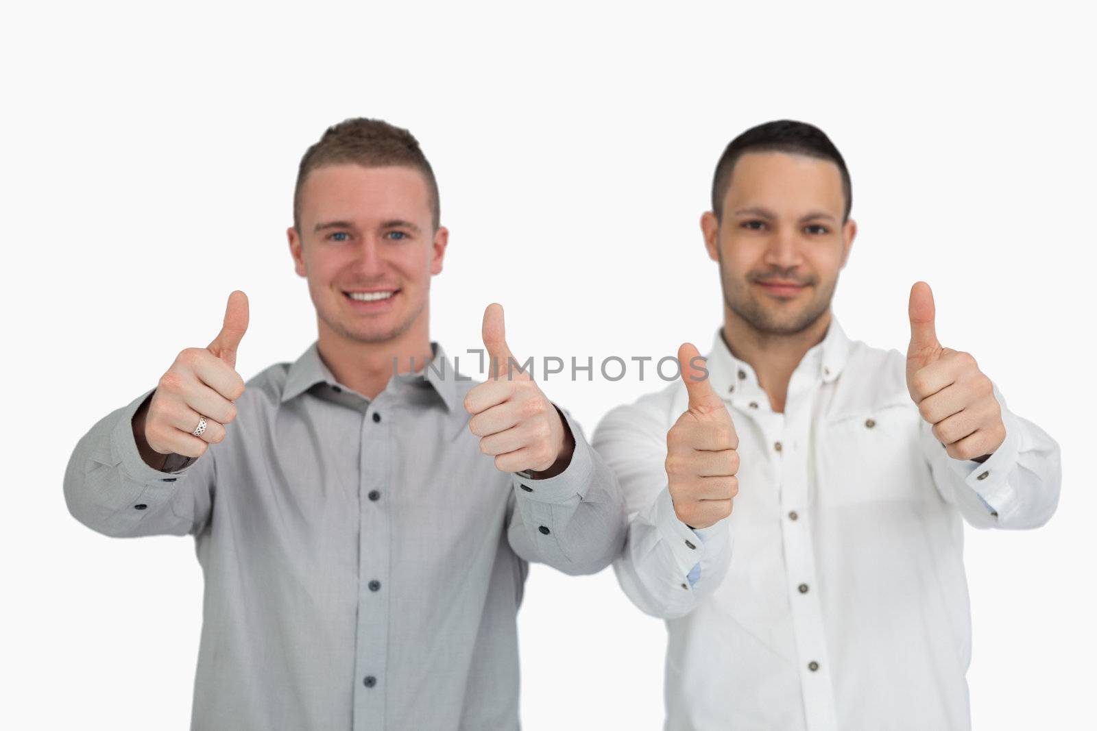 Two men putting their thumbs up against a white background