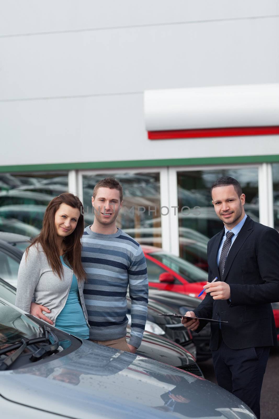 Clients buying a new car by Wavebreakmedia