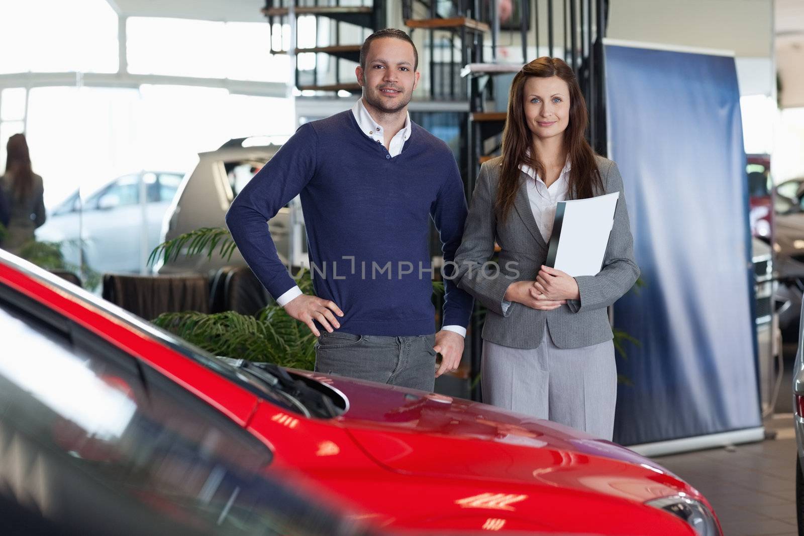 Man purchasing a new car in a dealership