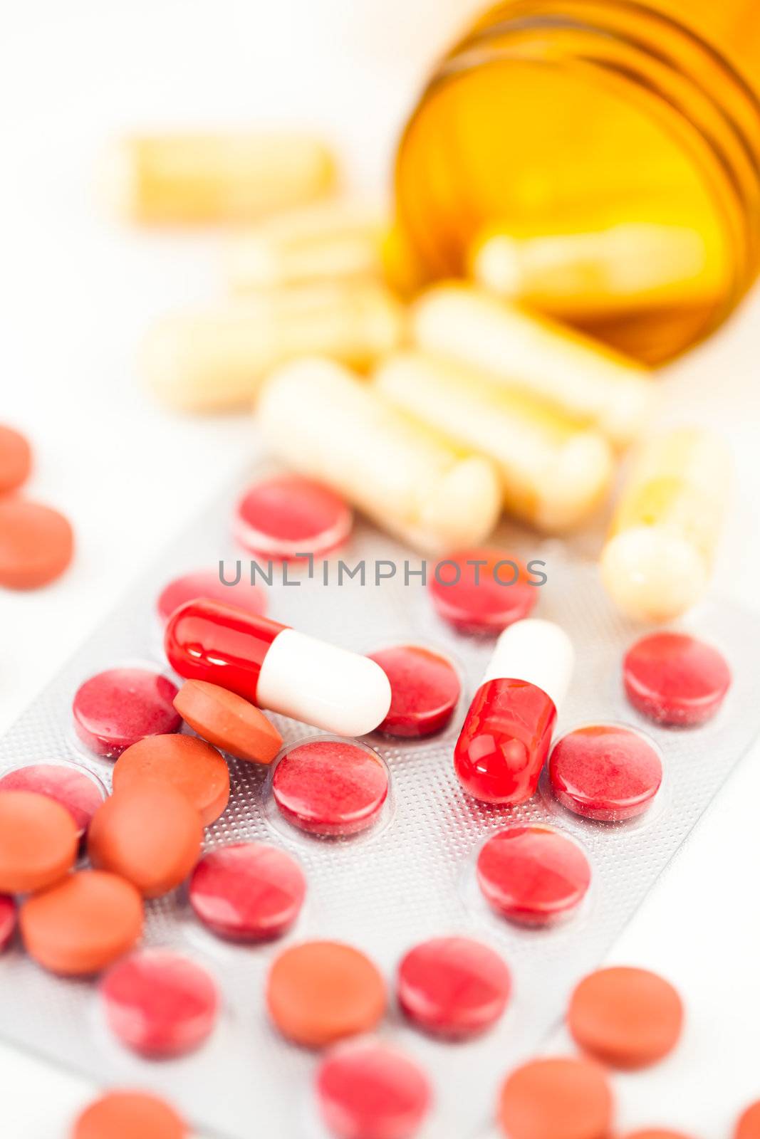 Medications dispersed against white background