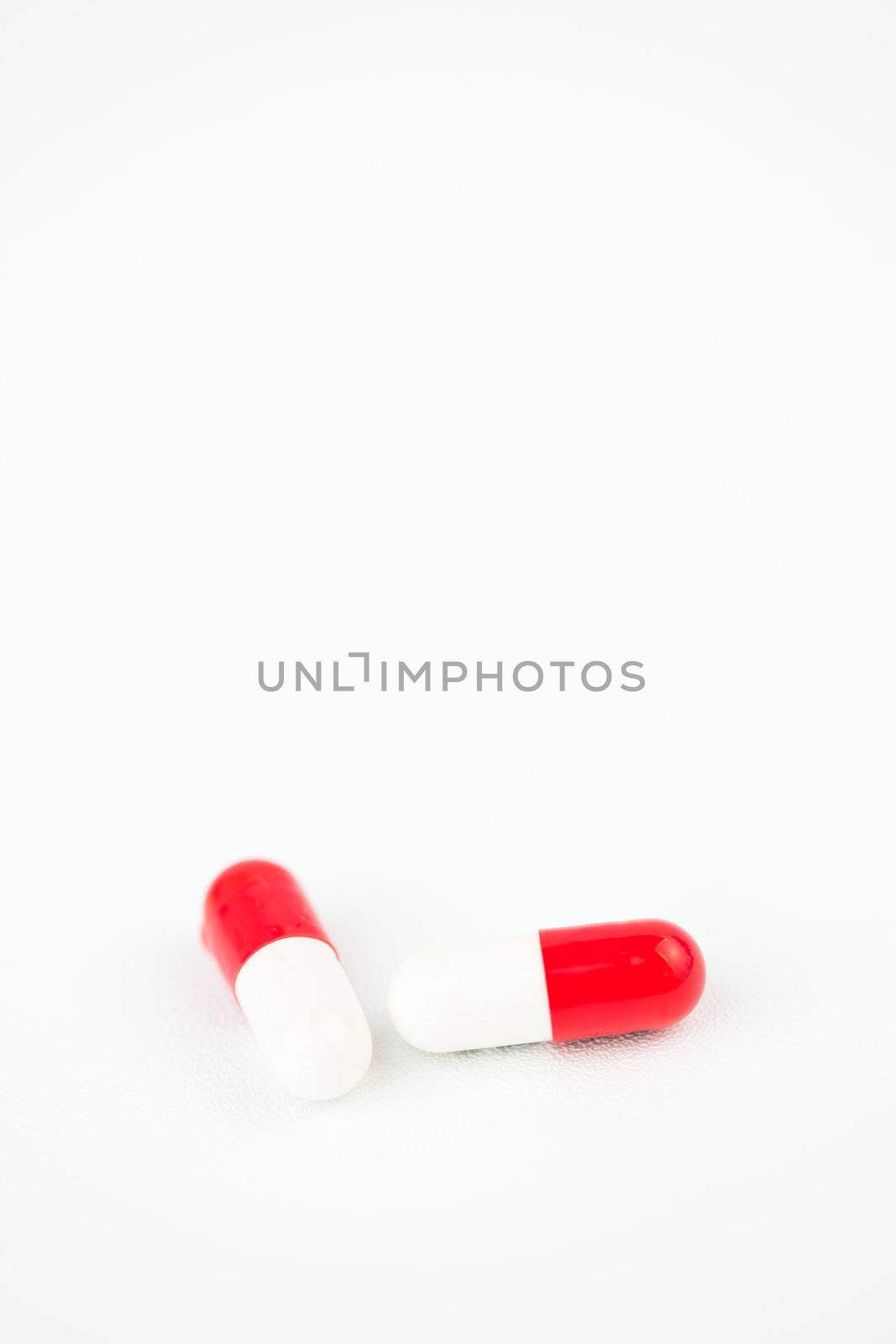 Two capsules against white background