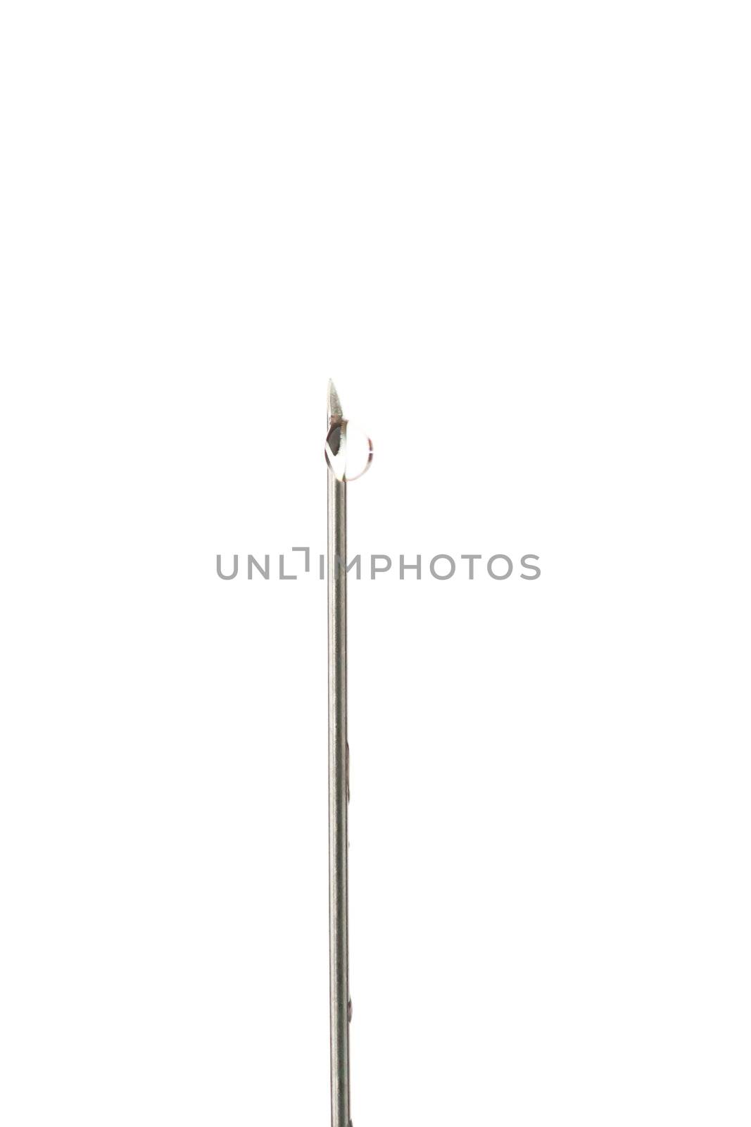 Drop outgoing of a needle against white background