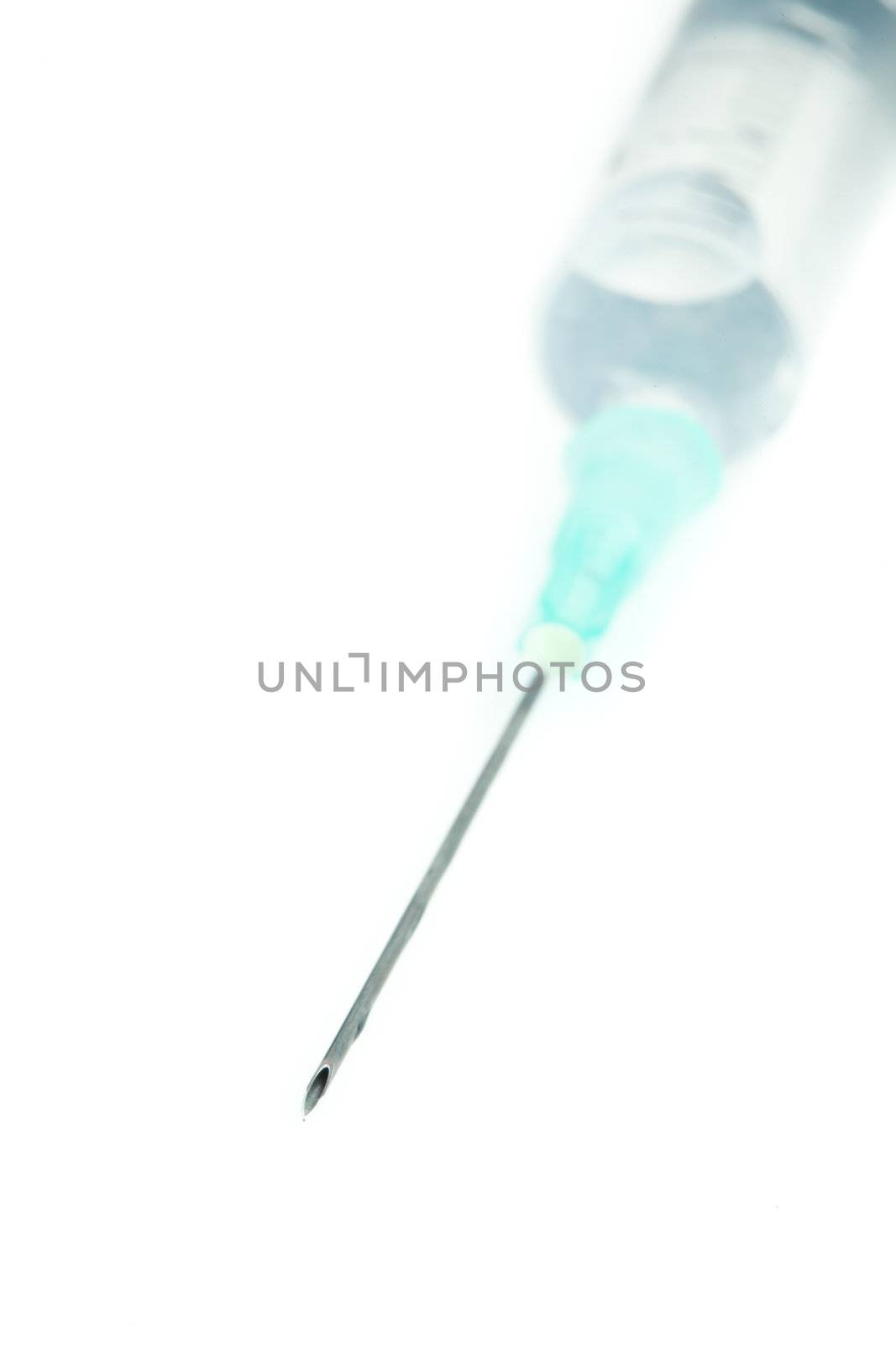 Syringe filled of liquid by Wavebreakmedia