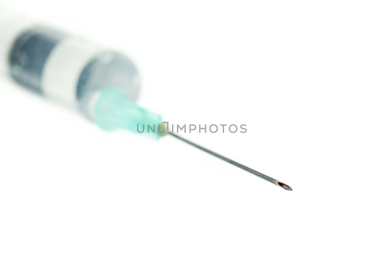 Syringe against white background