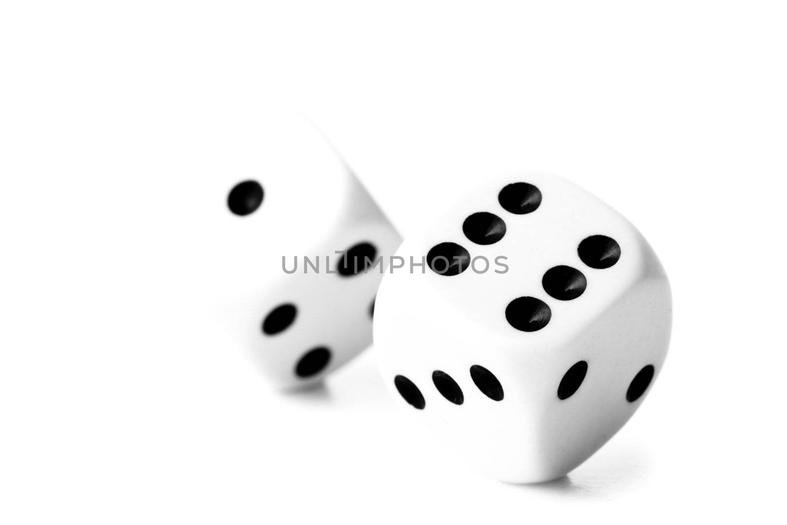 Two black and white dices against a white background