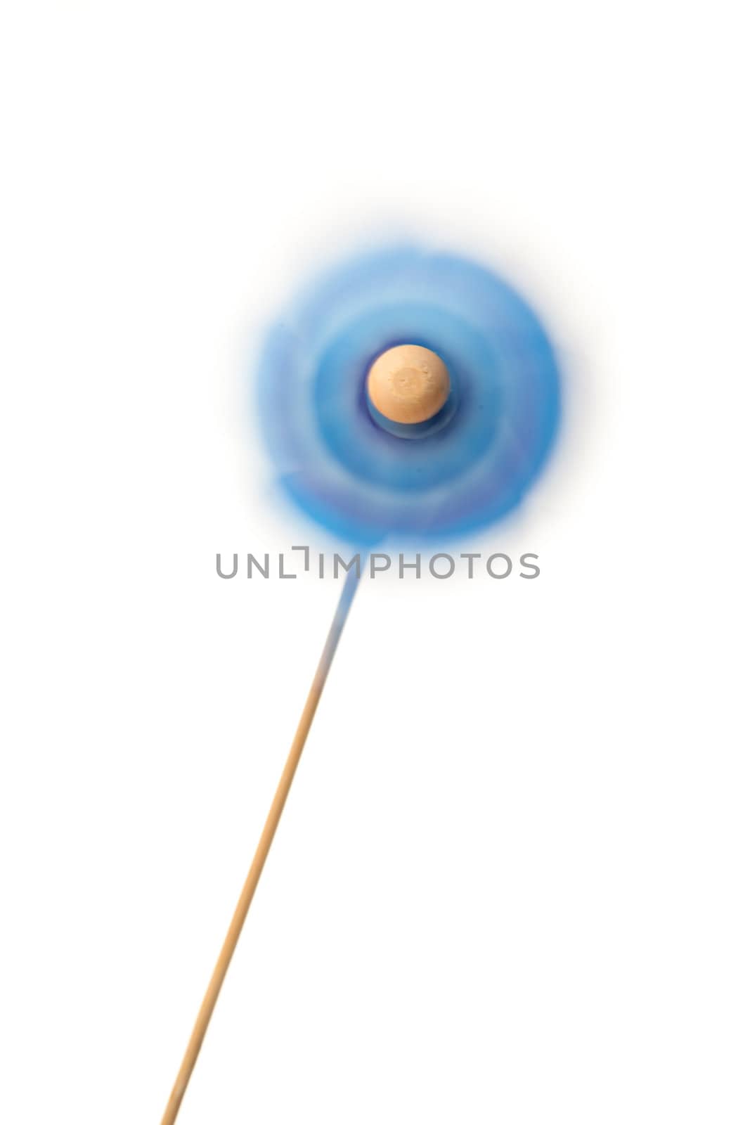 Blue pinwheel turning against a white background