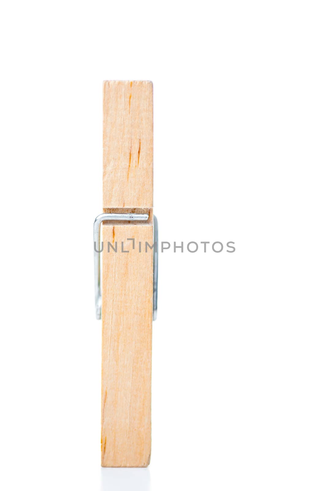 Wooden clothespin against a white background