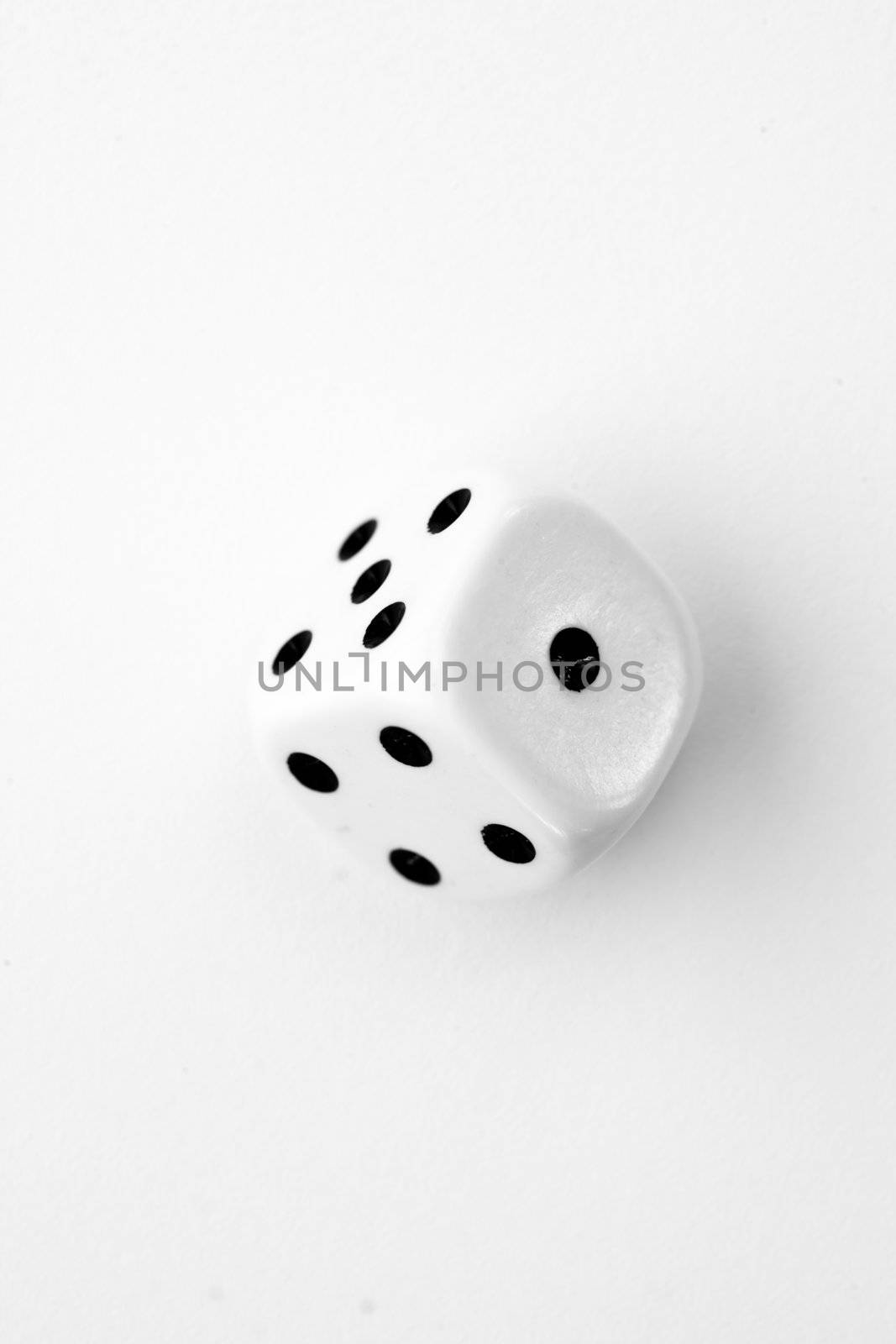 Black and white dice in motion by Wavebreakmedia