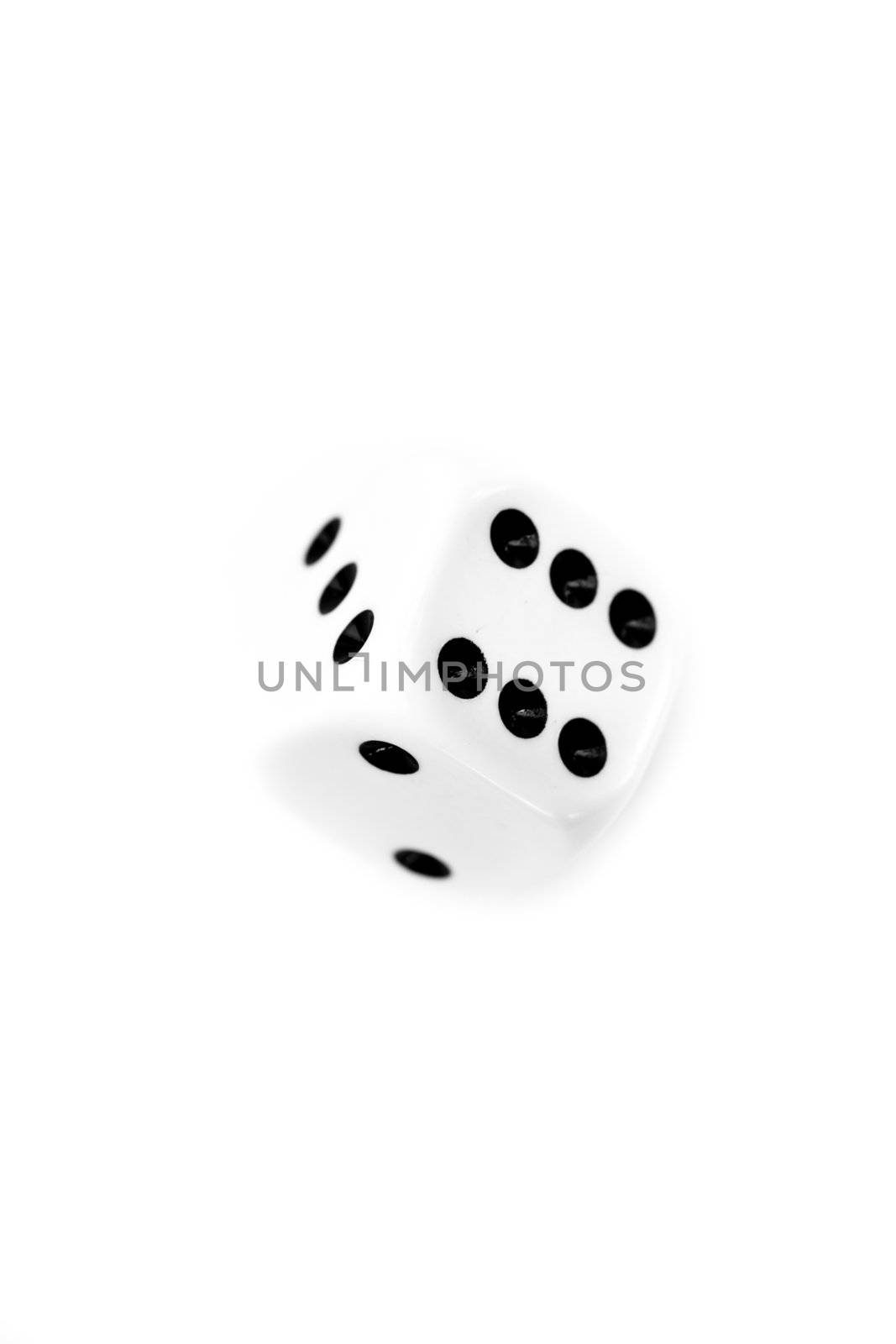 Dice in motion against a white background