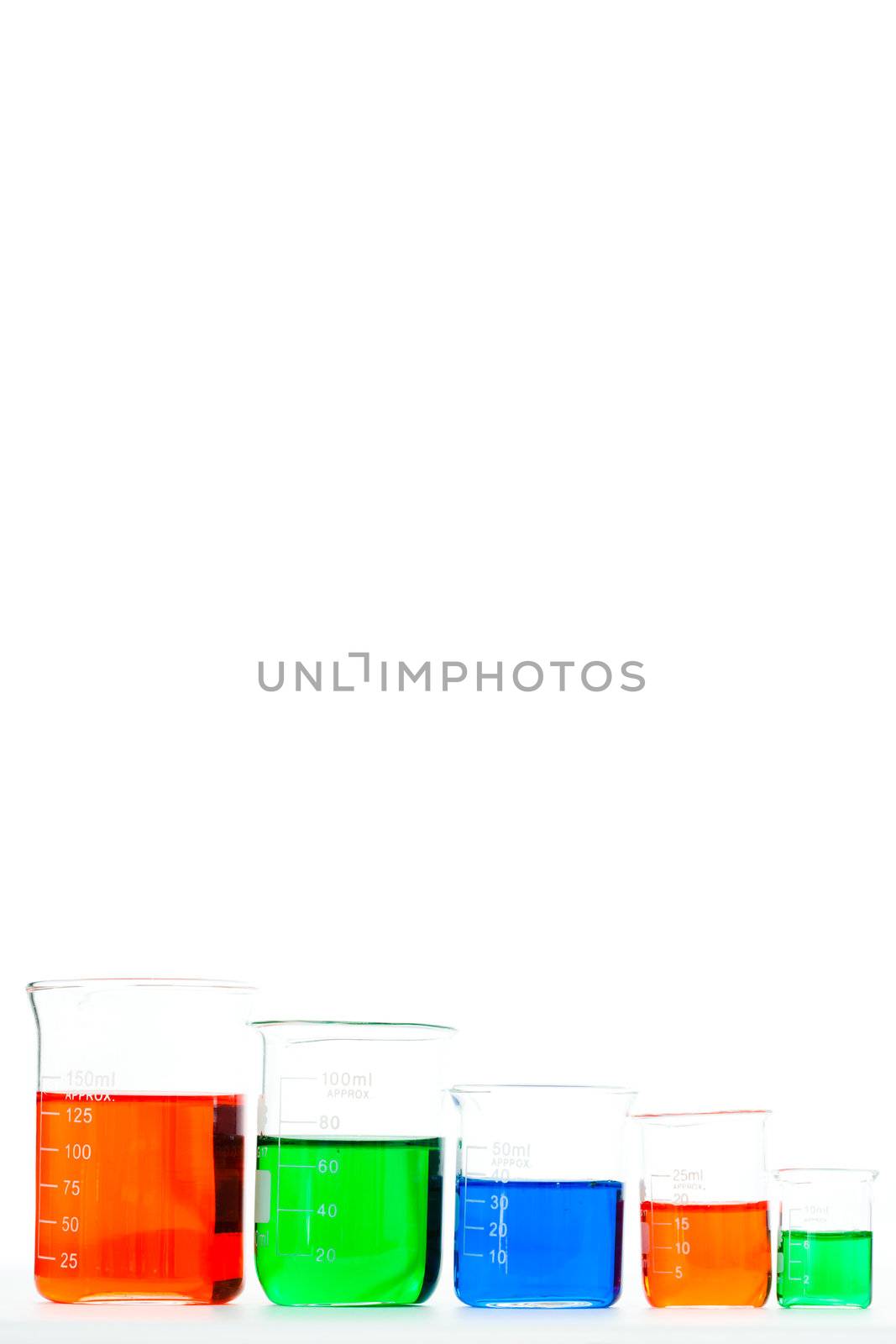 Five beakers in different size by Wavebreakmedia