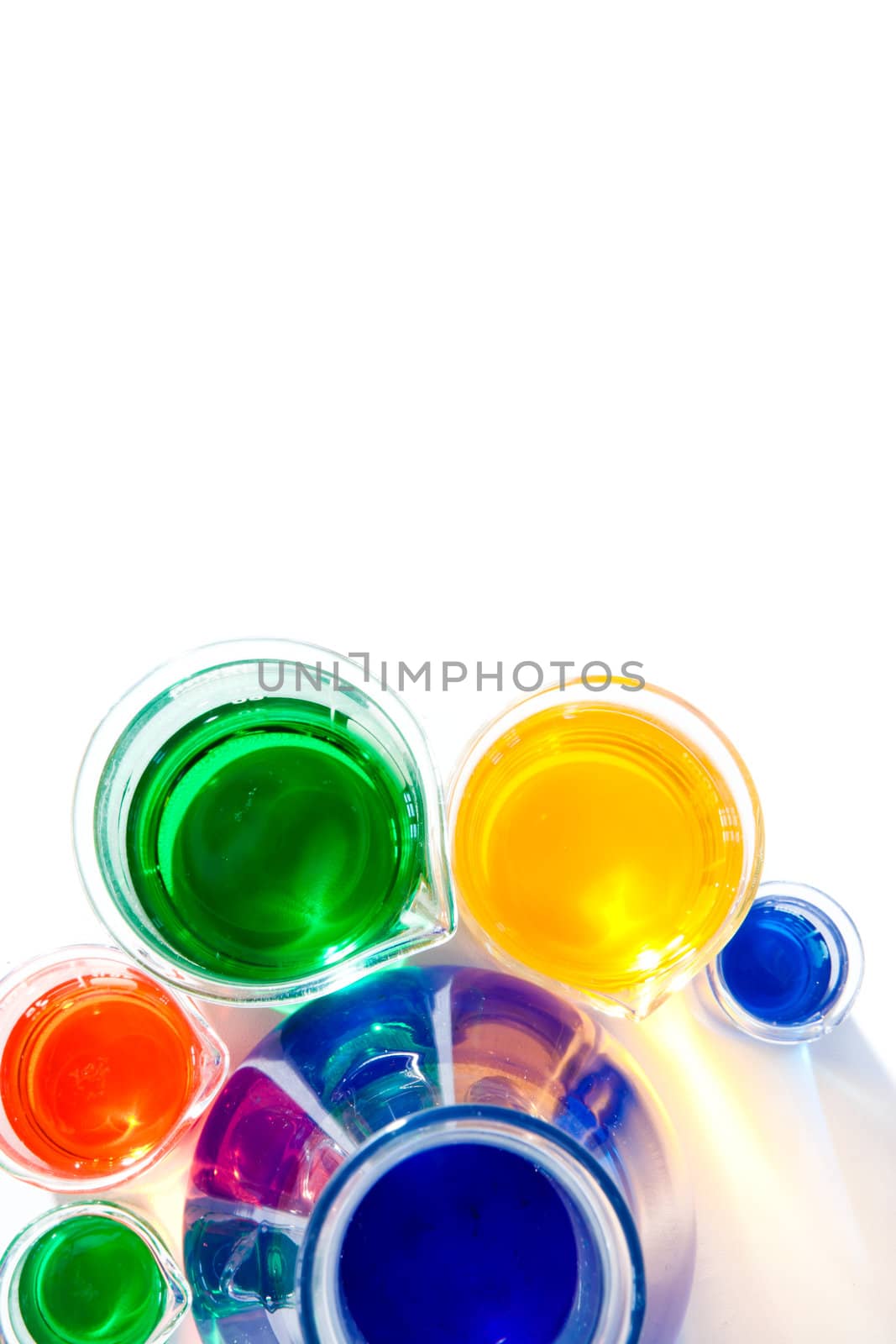 Beakers around an erlenmeyer against a white background