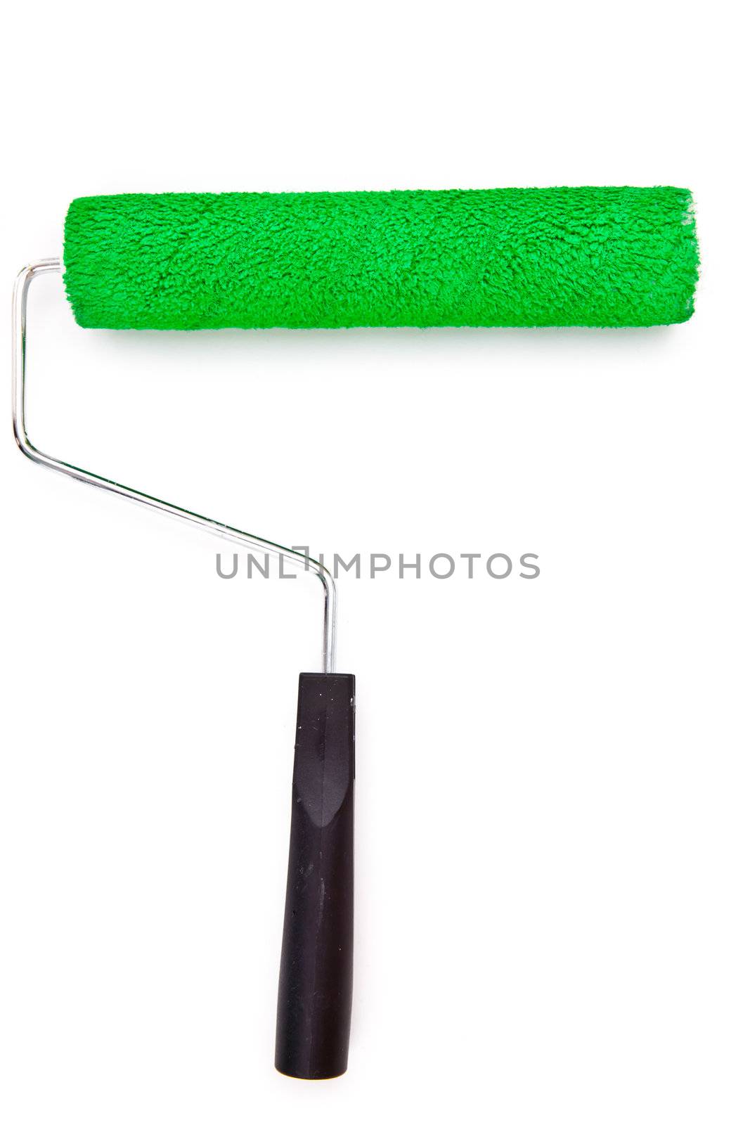 Green paint roller on white background