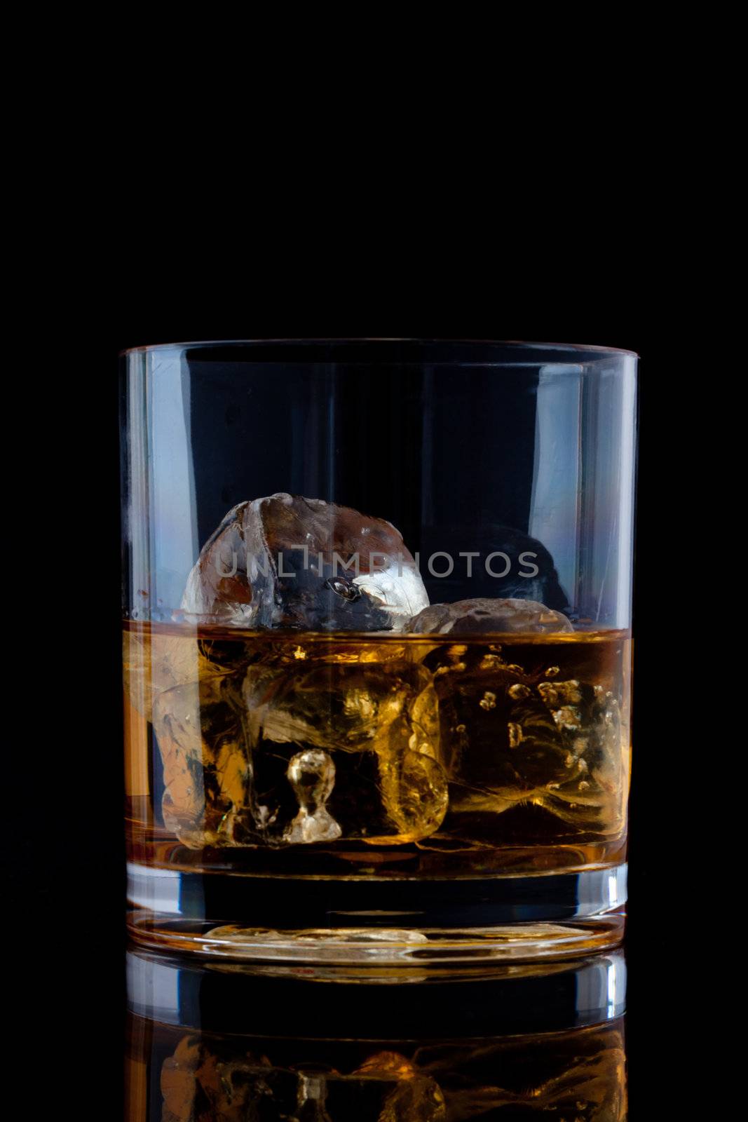 Glass with whiskey by Wavebreakmedia