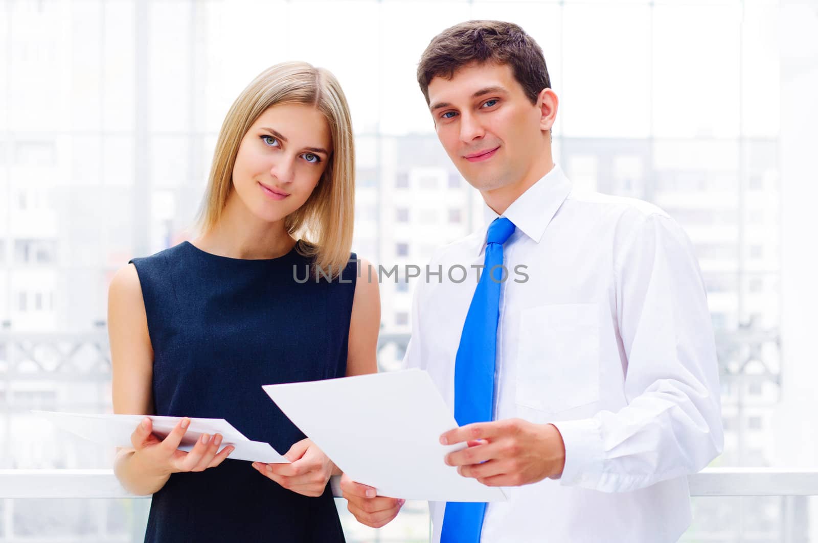 Portrait of young male and female entrepreneurs working together