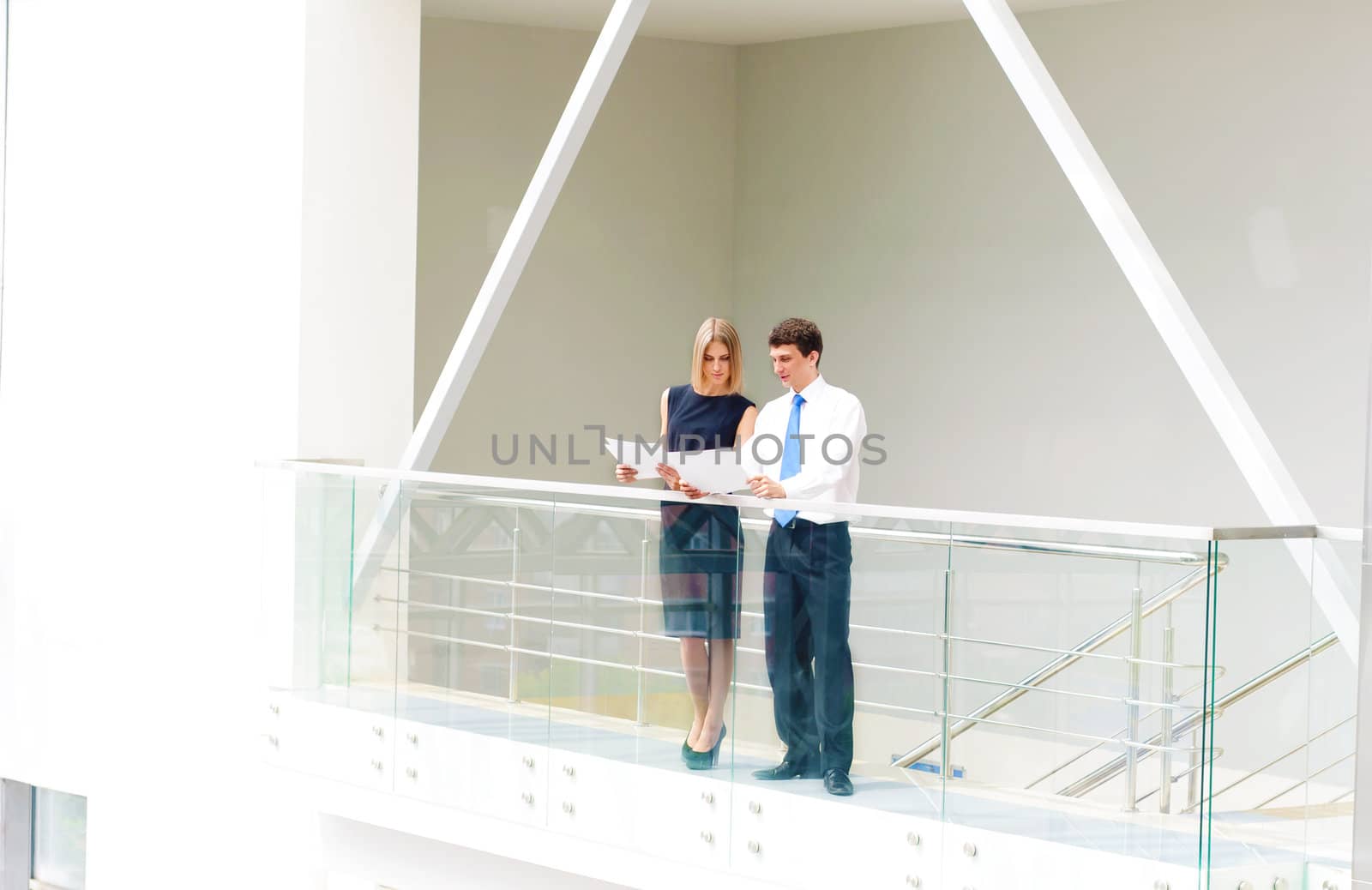 Portrait of young male and female entrepreneurs working together