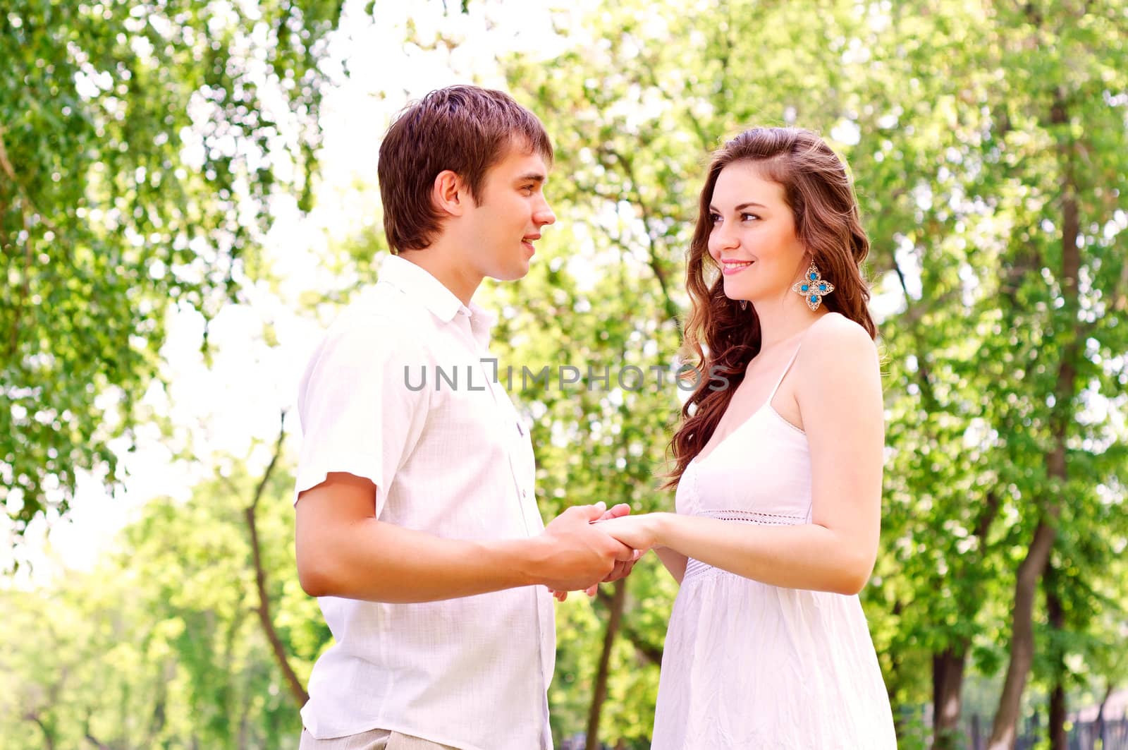 couple holding hands in the park by adam121