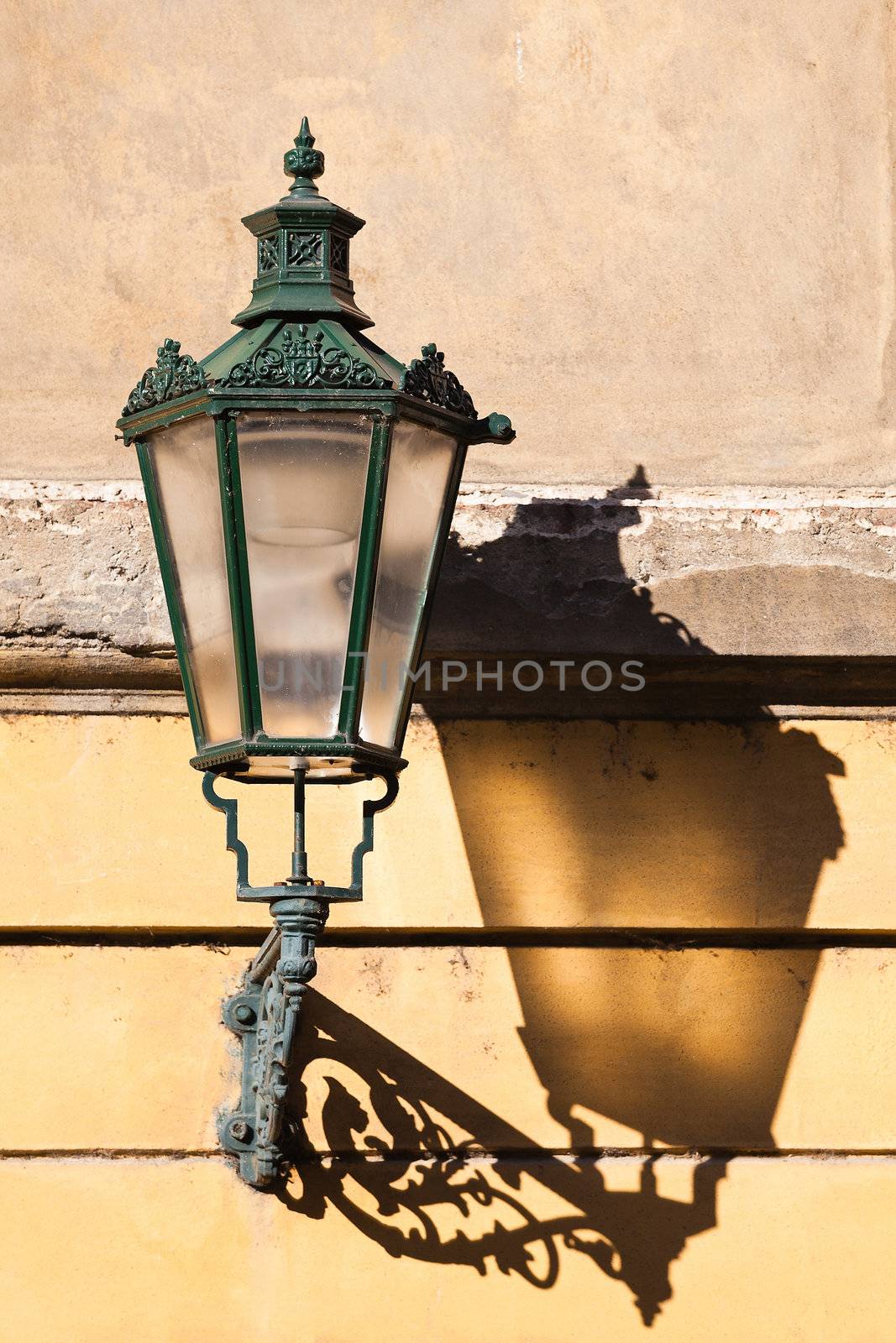 The lantern with its shadow on the yellow wall, Prague, Czech Republic