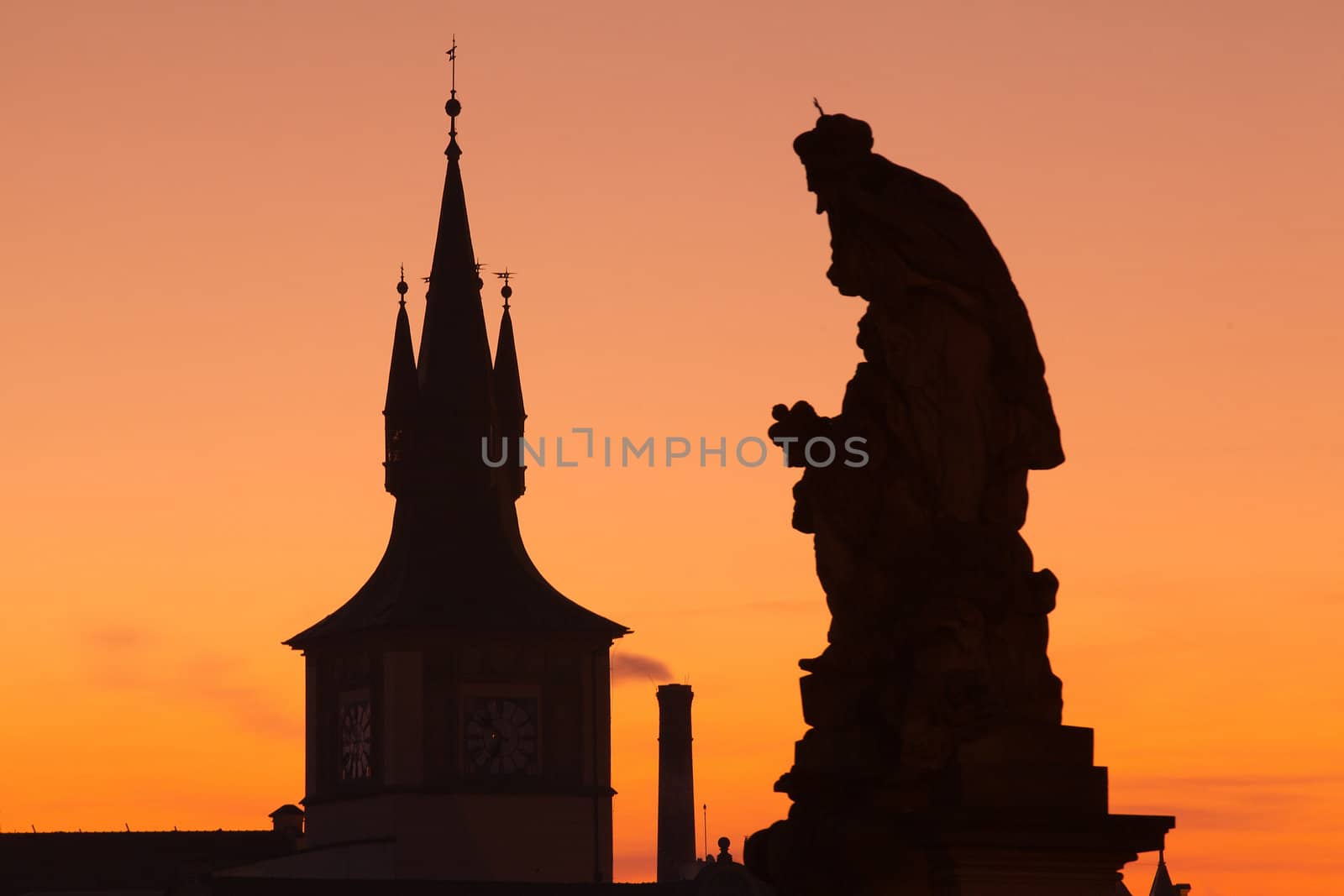 The statue and famous tower on Charles Bridge in Prague in Czech Republic