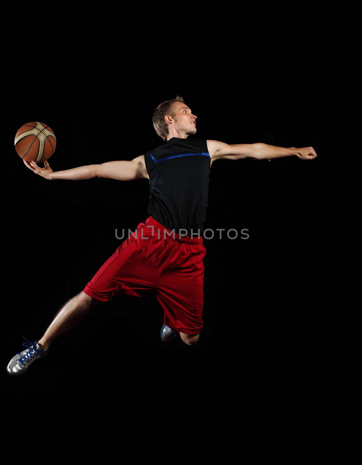 Basketball player with a ball by sergey_nivens