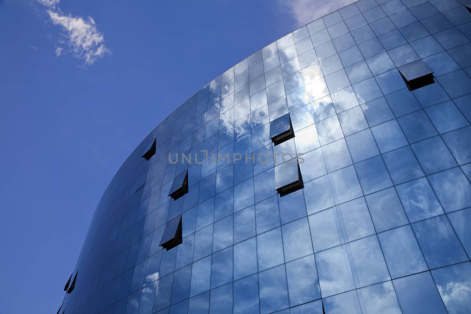 Futuristic corporate building with open windows in the summer heat Leon, Spain.