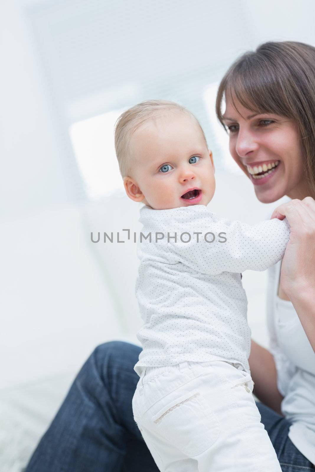 Mother with a baby in living room