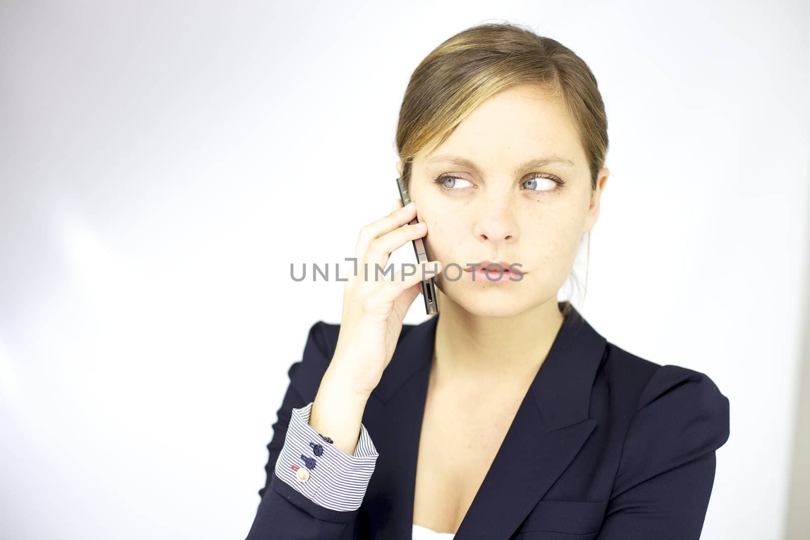 Business woman serious on the phone by fmarsicano