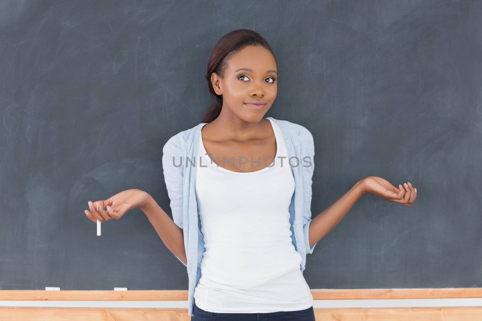 Black woman hesitating in a classroom