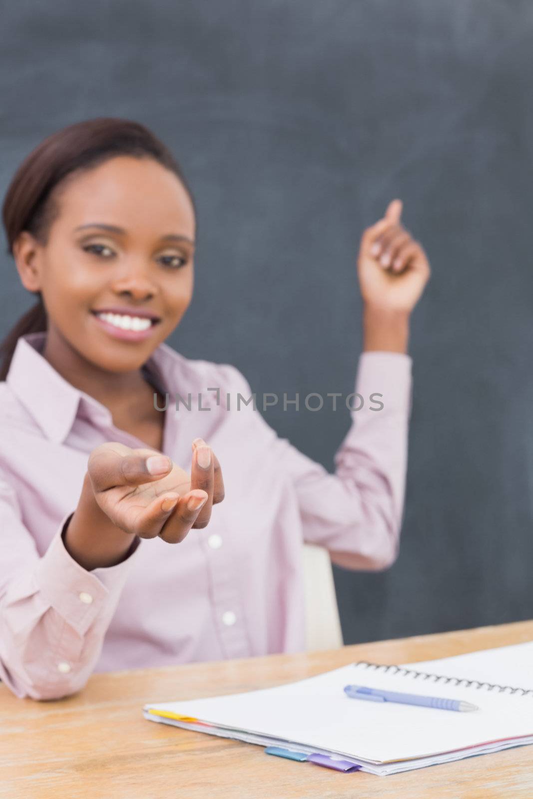 Focus on the hand on a teacher in a classroom