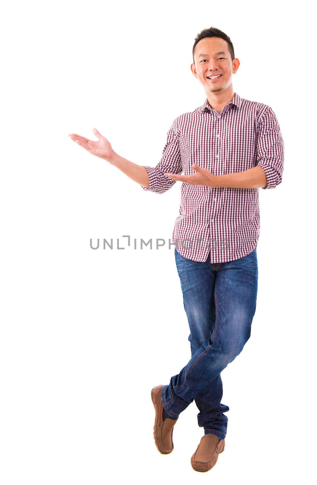 Portrait of a happy business man of Asian showing something on white background.