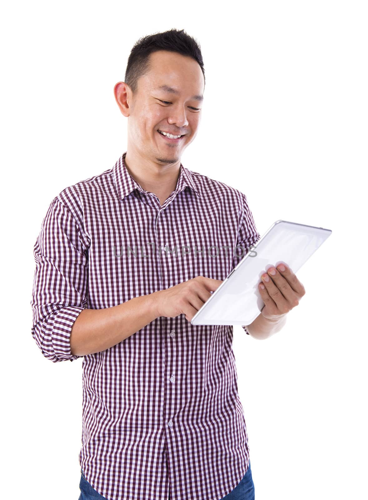 Asian man holding a digital touch screen tablet computer on white background.