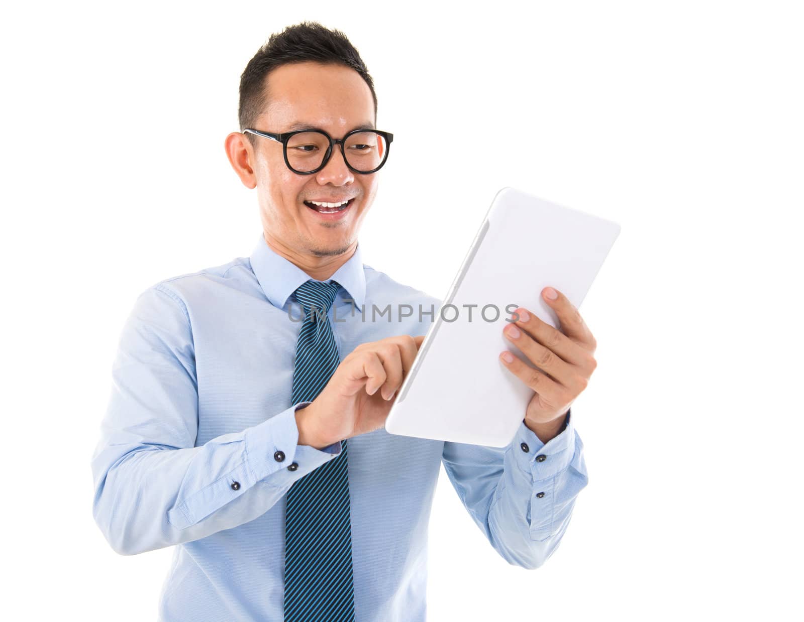 Handsome smiling Asian man with tablet computer. Isolated over white background