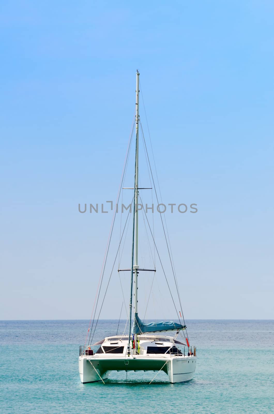 Luxury white sail catamaran boat in the sea by iryna_rasko