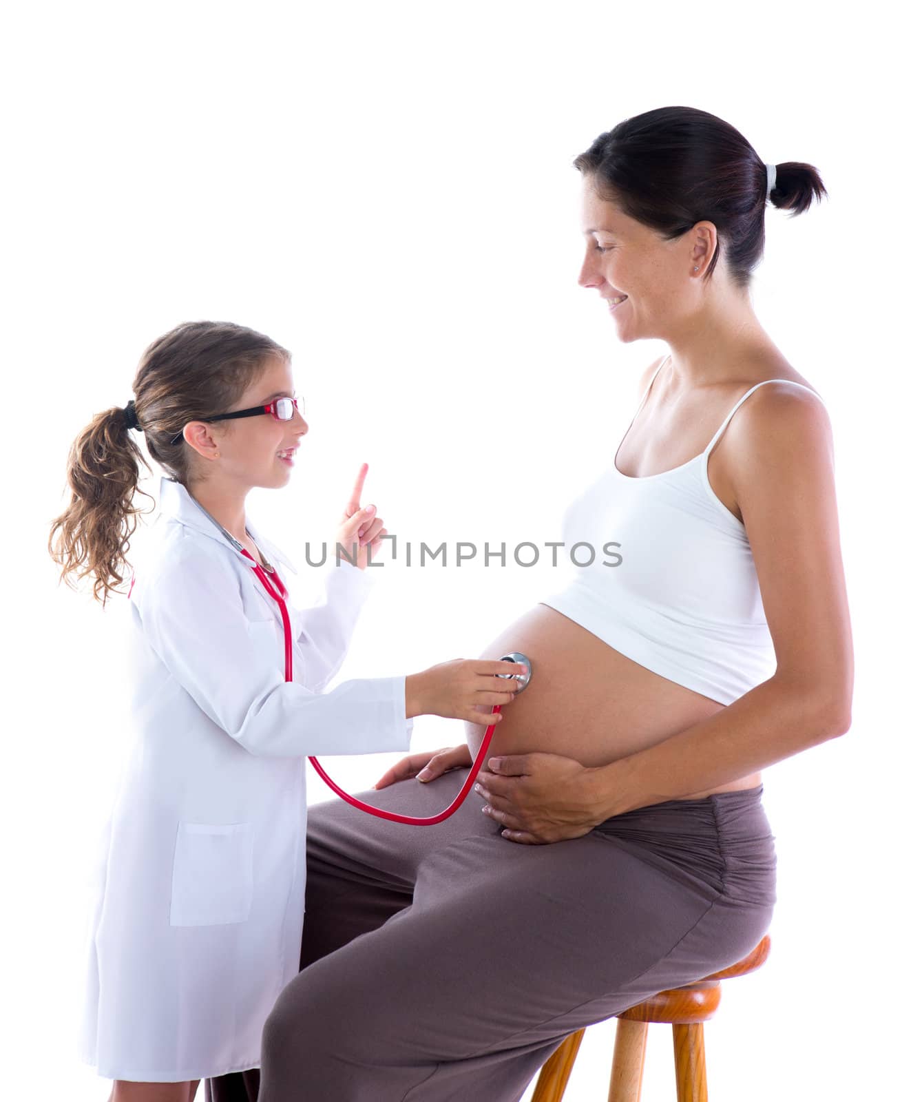 Beautiful pregnant womanand kid girl as stethoscope doctor by lunamarina