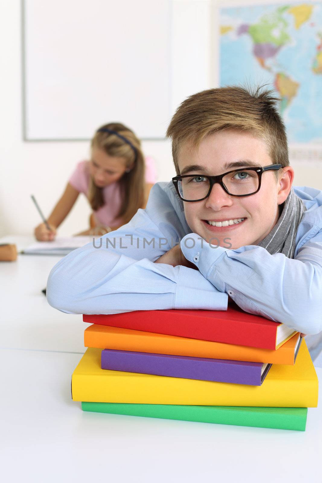 Happy student in his classroom by sumners