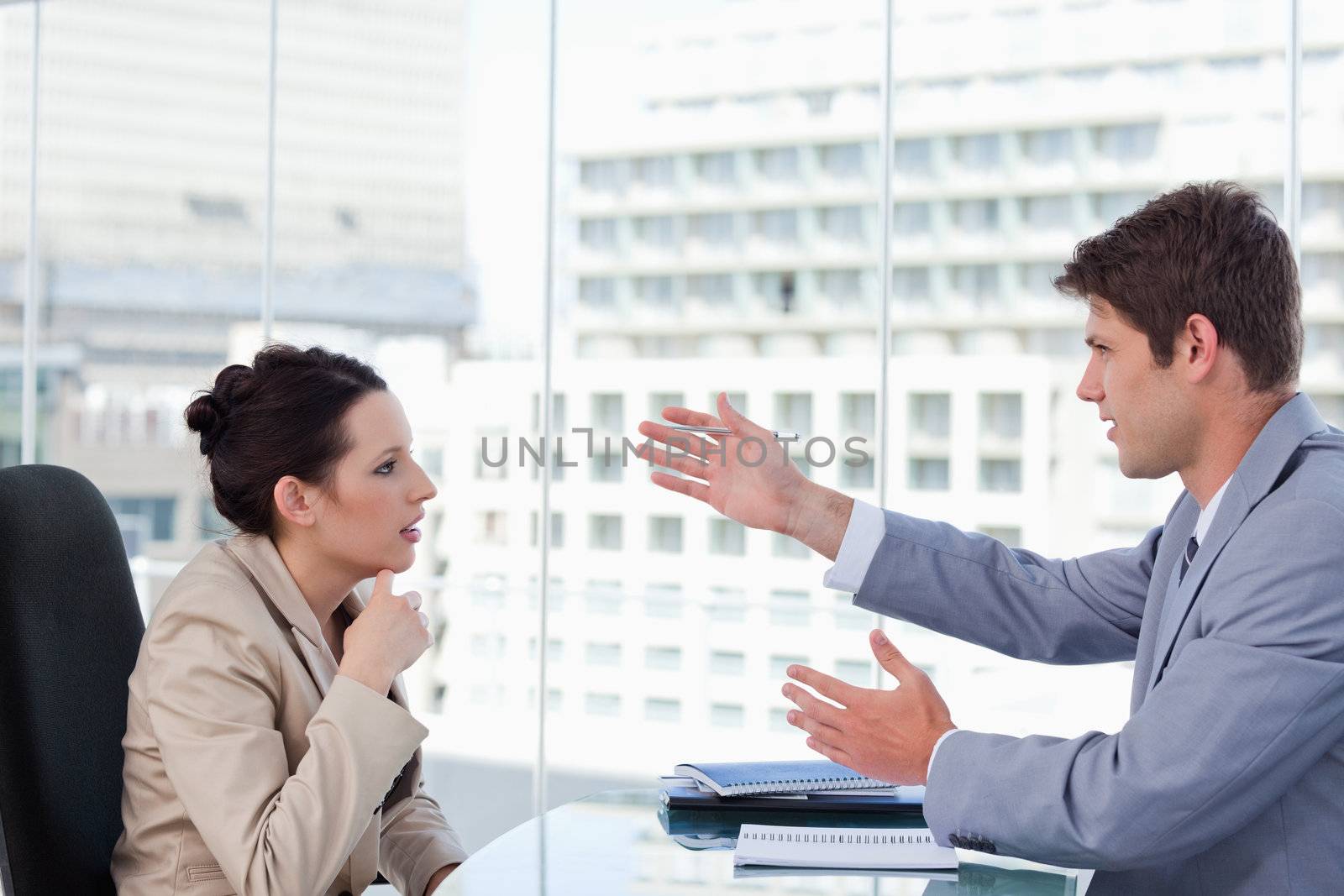 Serious business team negotiating in a meeting room
