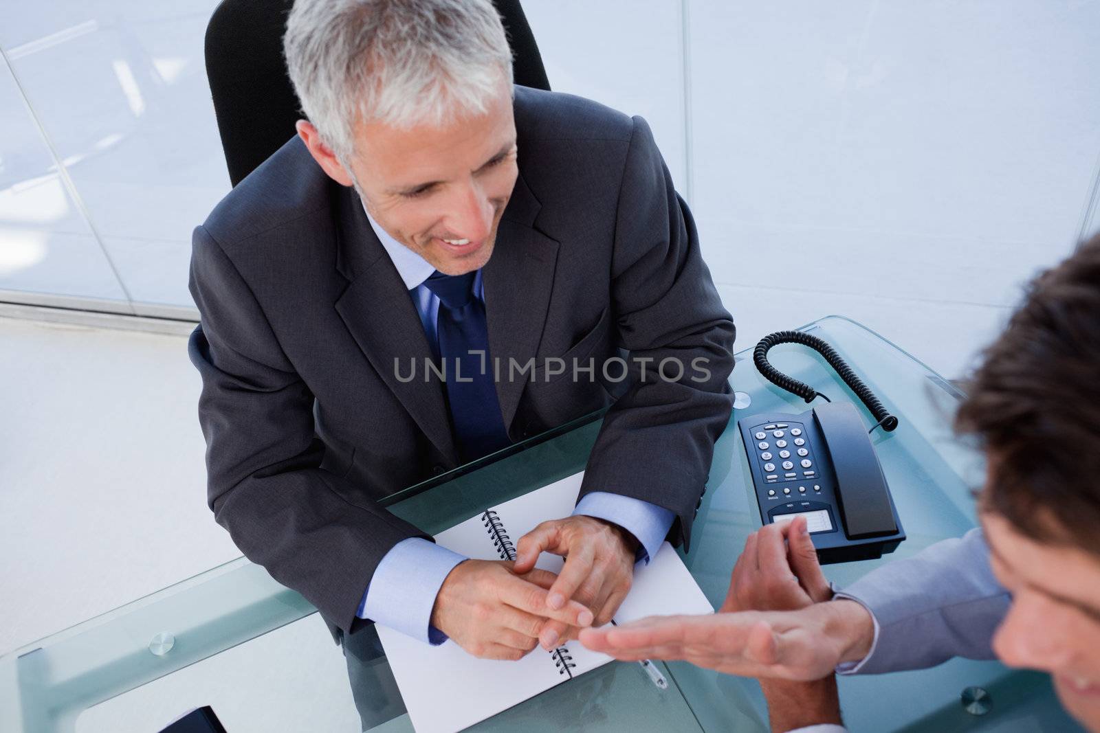 Above view of a businessman during a meeting in his office