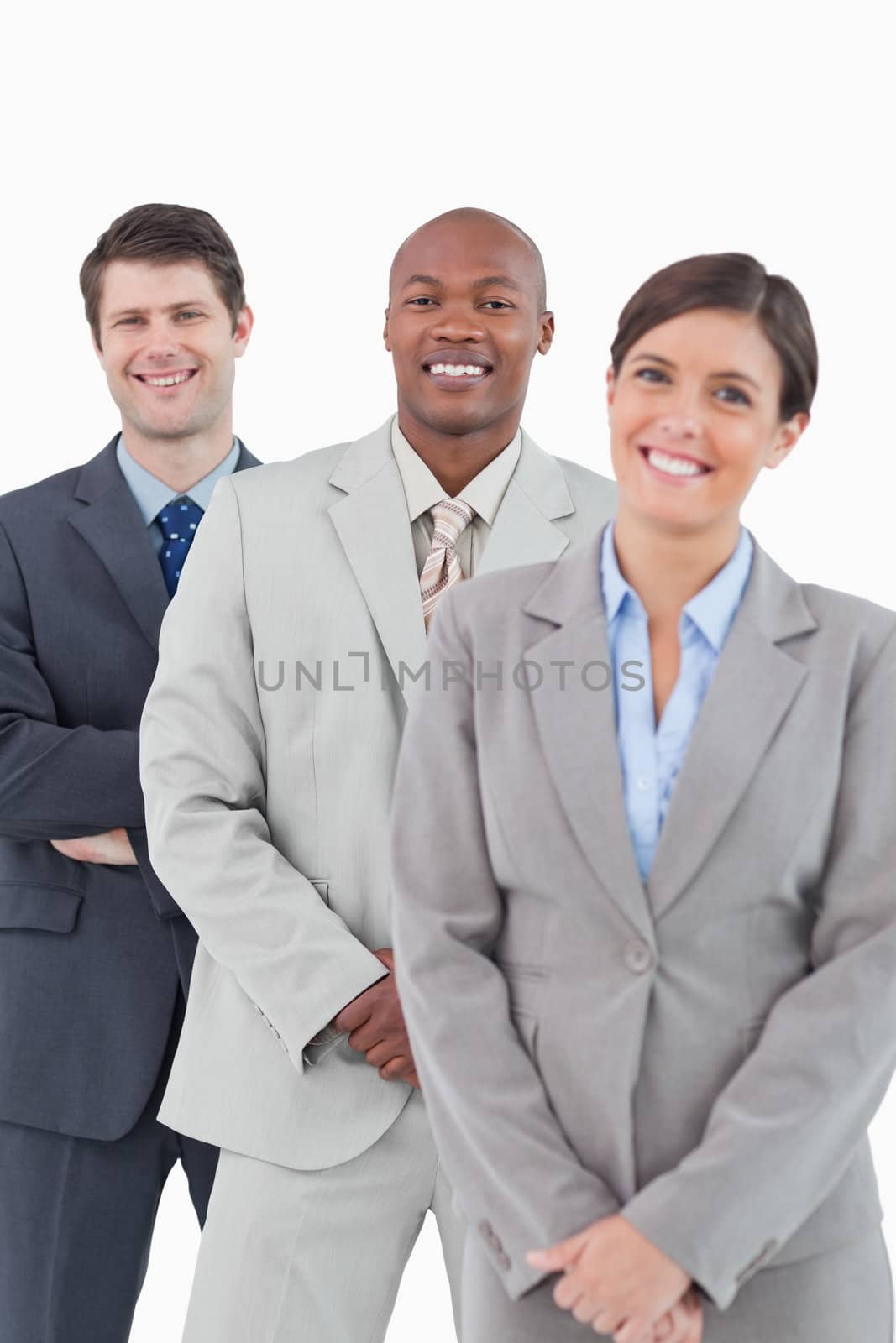 Smiling tradesteam standing together against a white background