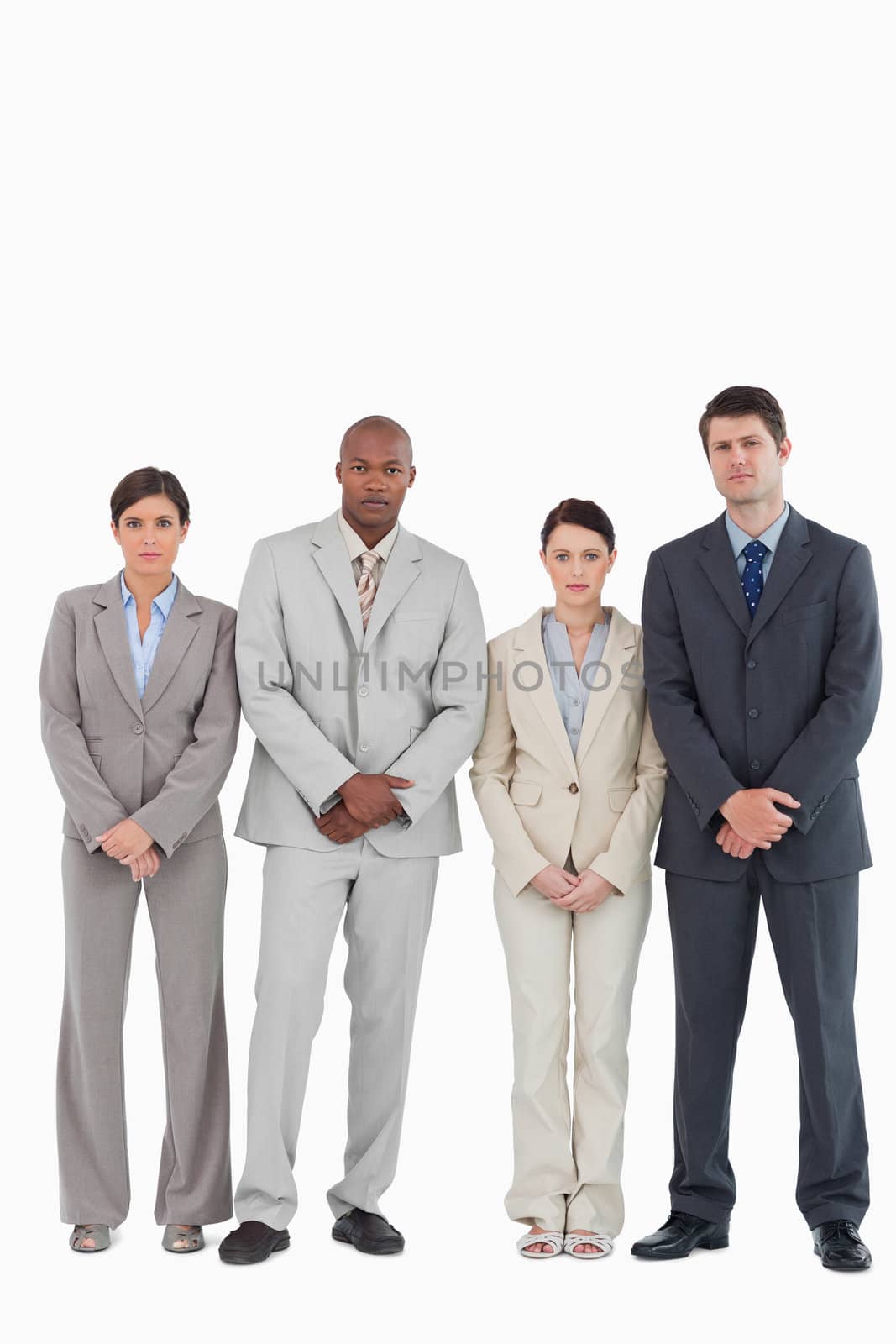 Confident young businessteam standing together against a white background
