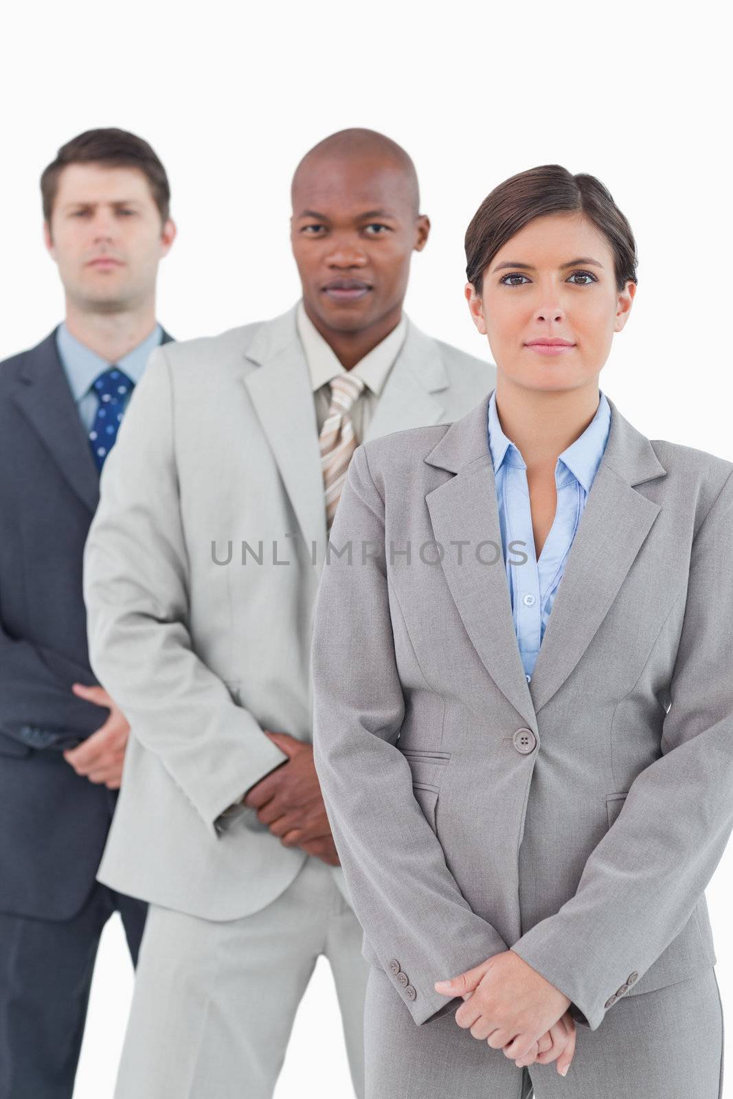 Young salesteam standing together against a white background