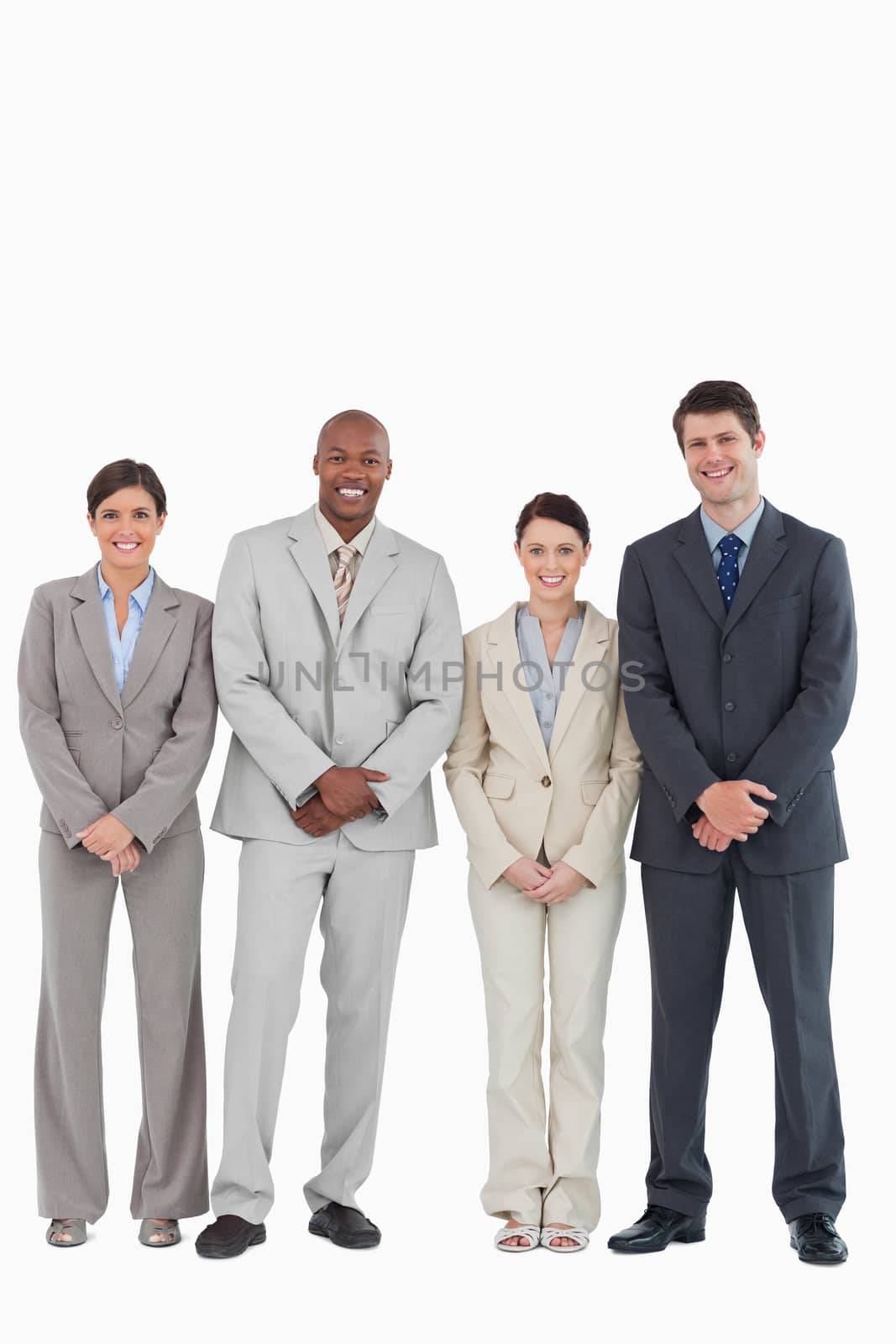 Smiling young businessteam standing together against a white background