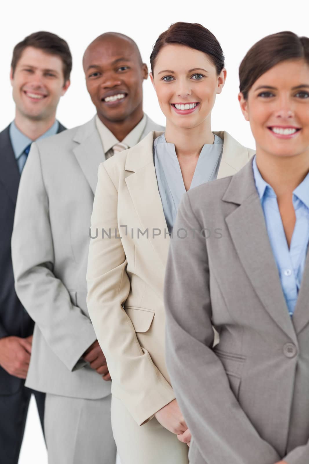 Confident smiling tradesteam standing together against a white background